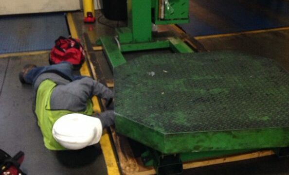 Best Packaging Service technician repairs a Highlight Synergy High Profile Stretch Wrapper.